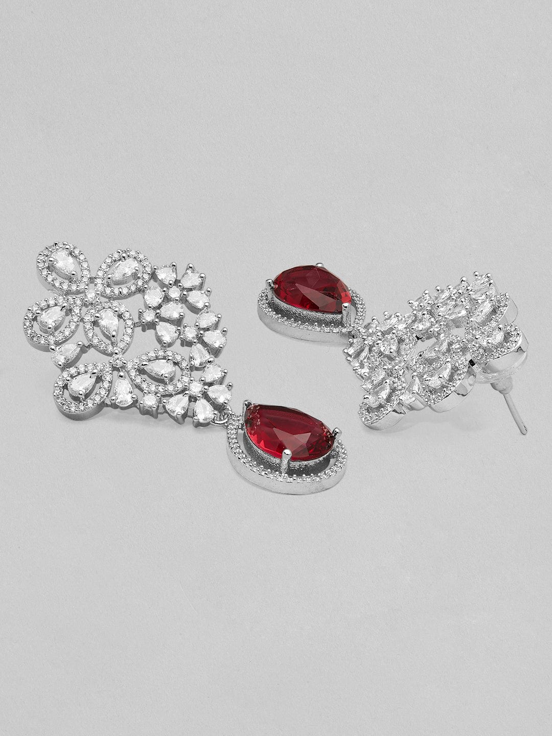 Rubans silver plated earrings with studded american diamonds and red stones. Earrings