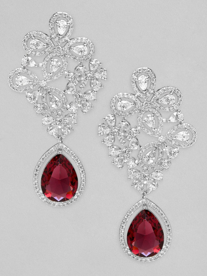 Rubans silver plated earrings with studded american diamonds and red stones. Earrings