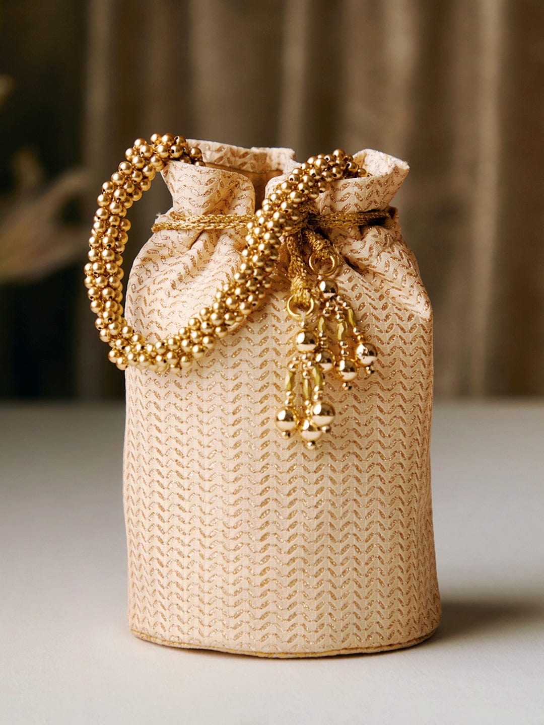 Rubans Cream Colour Potli Bag With Golden Print And Golden Beads Design. Handbag & Wallet Accessories