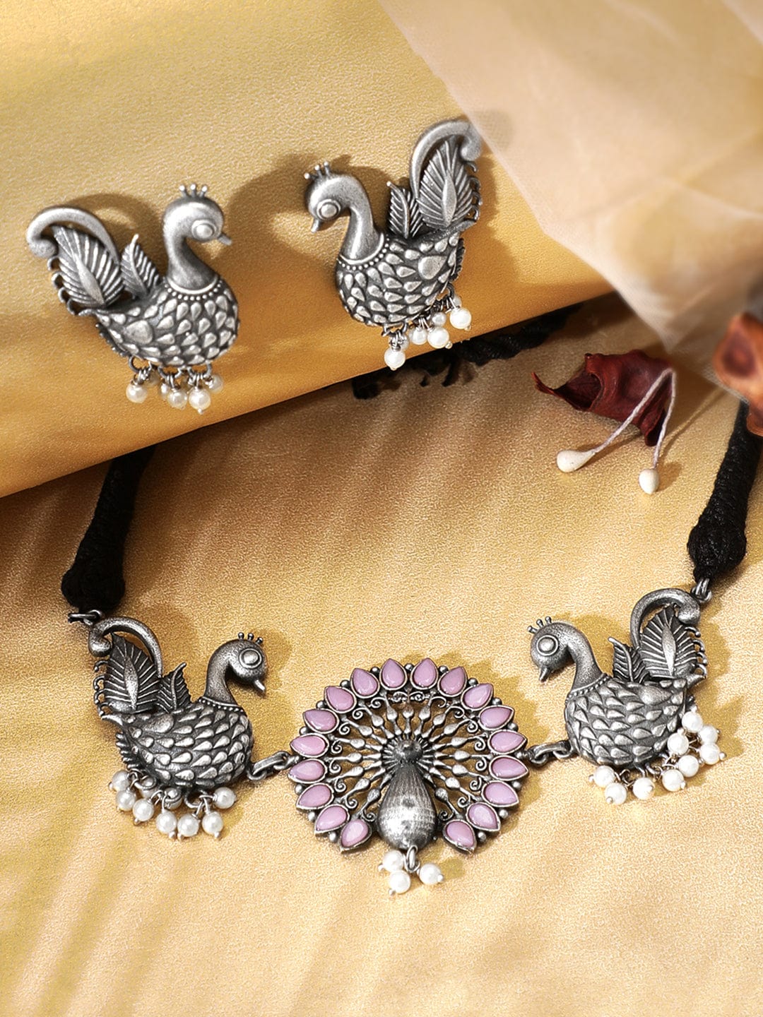 Rubans Oxidised Silver Handcrafted Ruby Studded Peacock Necklace Set. Necklace Set
