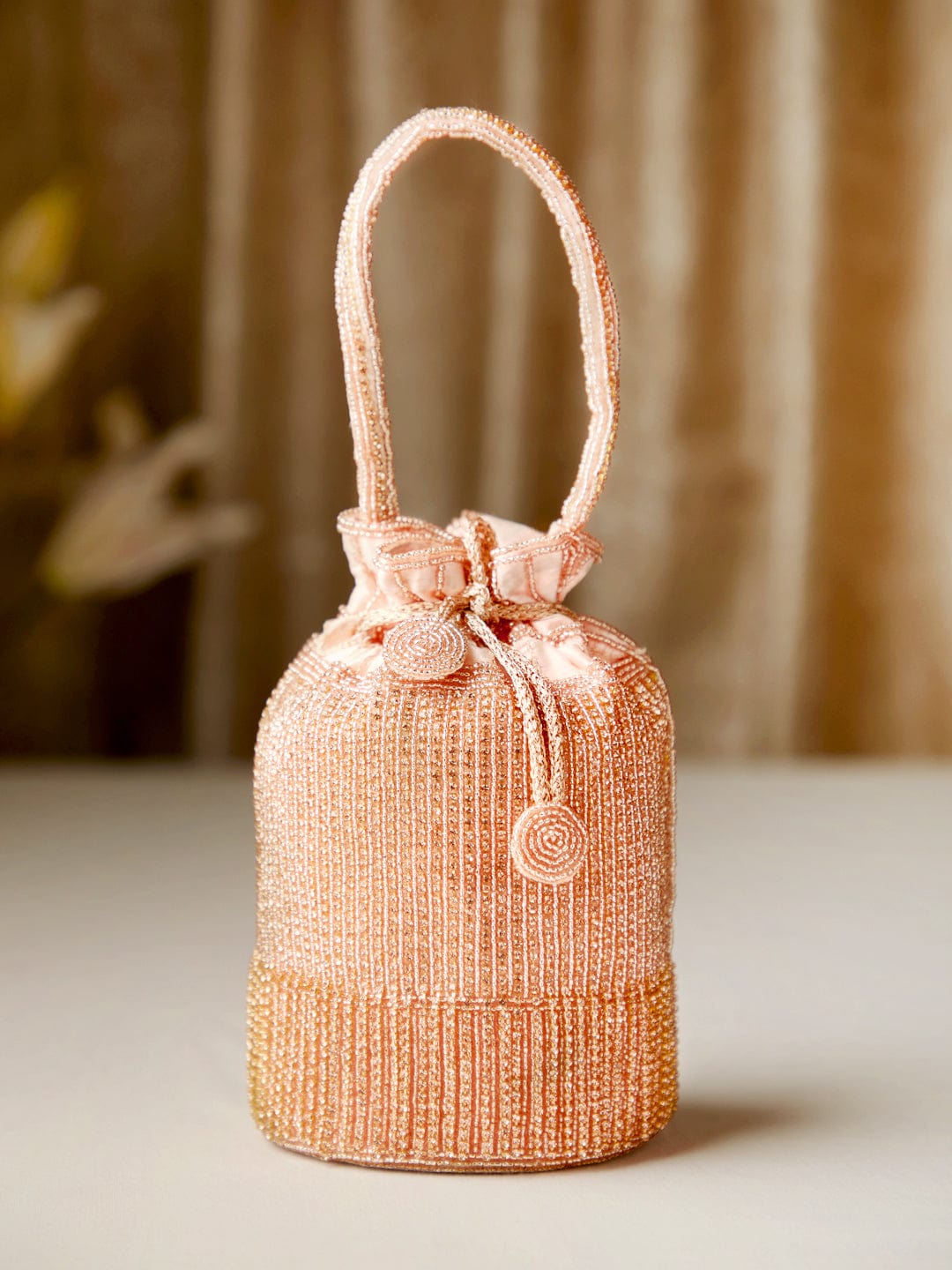 Rubans Peach Coloured Potli Bag With Golden Embroided Design. Handbag &amp; Wallet Accessories